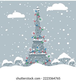 New Year's Eiffel Tower in garlands under the snow