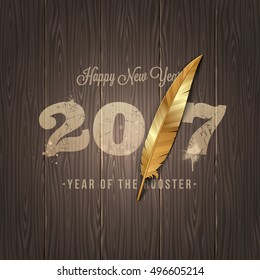 New years greeting with golden feather of a rooster on a wooden surface - vector illustration