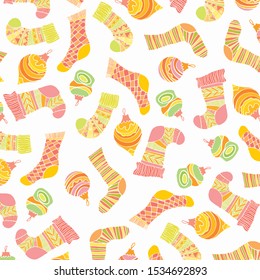 New Year`s pattern with socks and Christmas-tree decorations on a white background