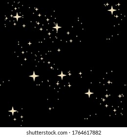 New year's pattern of stars. Gold stars for Christmas. Packaging paper, background image.
