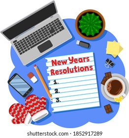 New Years resolution with laptop, cup and mittens. Wish list to make in the new year