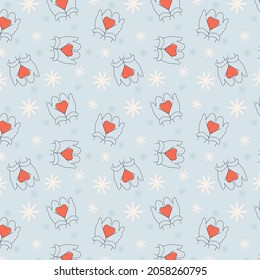 New year's seamless pattern with hands in knitted mittens holding red heart