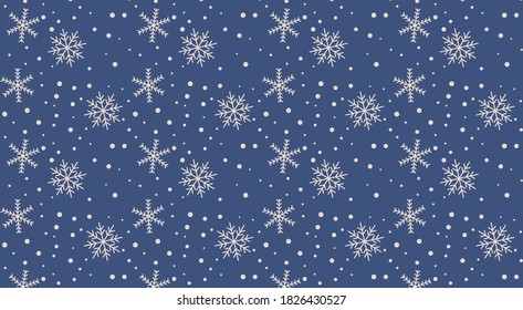 Patrón sin fisuras de copos de nieve de Año Nuevo sobre un fondo azul