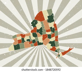 New York vintage map. Grunge poster with map of the US state in a retro color palette. Shape of New York with sunburst rays background. Vector illustration.