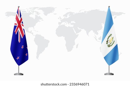 New Zealand and Guatemala flags for official meeting against background of world map.