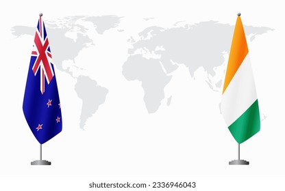 New Zealand and Ivory Coast flags for official meeting against background of world map.