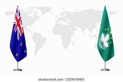 New Zealand and Macau flags for official meeting against background of world map.