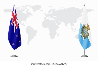 New Zealand and San Marino flags for official meeting against background of world map.