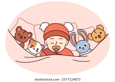 Newborn baby sleeps soundly in bed among toys or sucks on pacifier for concept of child care. Innocent newborn with toys lies under blanket and falls asleep after feeding infant formula in morning