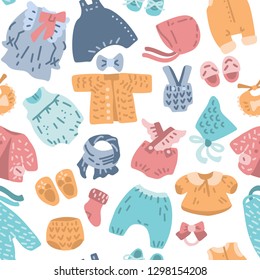 Newborn Baby vintage clothes vector set. Classic Boho apparel for infants. 
Illustration made in doodle style, colourful seamless background.