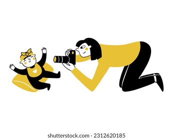 Newborn photographer kneeling taking pictures of a baby