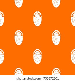 Newborn wrapped in baby blanket pattern repeat seamless in orange color for any design. Vector geometric illustration