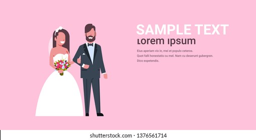 newlyweds just married man woman standing together romantic couple bride and groom in love wedding day concept pink background copy space full length horizontal flat