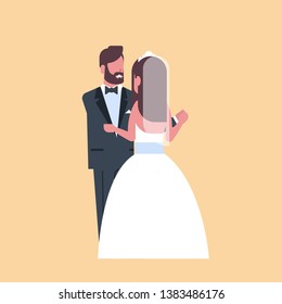newlyweds just married man woman embracing dancing together romantic couple bride and groom in love wedding day concept yellow background full length flat