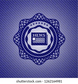 newspaper icon inside badge with denim background