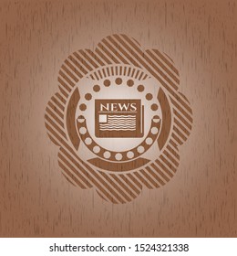 newspaper icon inside badge with wooden background