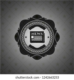 newspaper icon inside black emblem