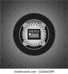 newspaper icon inside black emblem