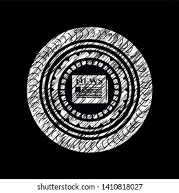 newspaper icon inside chalkboard emblem written on a blackboard