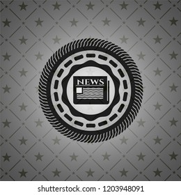 newspaper icon inside dark emblem