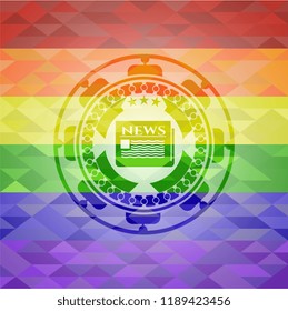 newspaper icon inside emblem on mosaic background with the colors of the LGBT flag