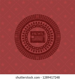 newspaper icon inside red emblem