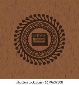 newspaper icon inside vintage wood emblem