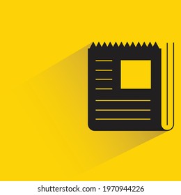newspaper with shadow yellow background