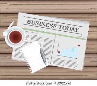 newspaper and tea with blank paper and pen on wood