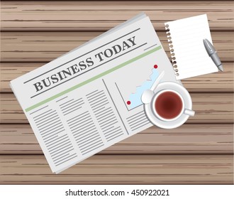 newspaper and tea with blank paper and pen on wood