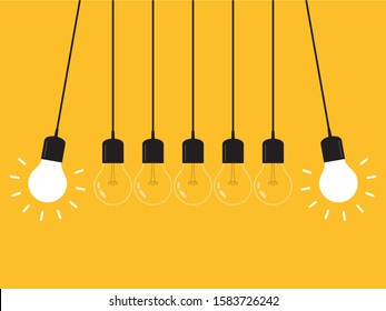Cuna de Newton con bombilla brillante. Péndulo. El concepto de liderazgo, poder y singularidad.