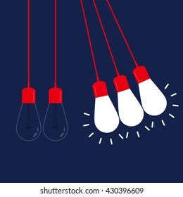 Newton's cradle with glowing light bulb. Pendulum. Leadership, power and uniqueness concept.