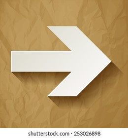 Next arrow on crumpled paper brown background