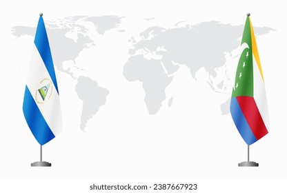 Nicaragua and Comoros flags for official meeting against background of world map.