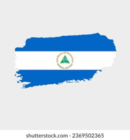 Nicaragua flag with grunge texture. Vector illustration of Nicaragua flag painted with brush with grunge effect and watercolor stroke. Happy Independence Day.