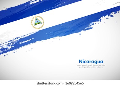 Nicaragua flag made in brush stroke background. National day of Nicaragua. Creative Nicaragua national country flag icon. Abstract painted grunge style brush flag background.