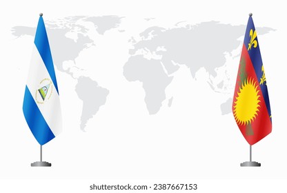 Nicaragua and Guadeloupe flags for official meeting against background of world map.