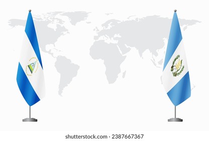 Nicaragua and Guatemala flags for official meeting against background of world map.