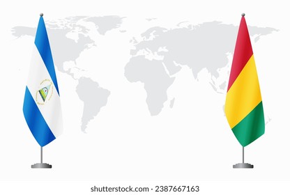 Nicaragua and Guinea flags for official meeting against background of world map.