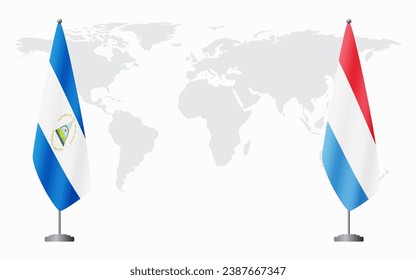 Nicaragua and Luxembourg flags for official meeting against background of world map.