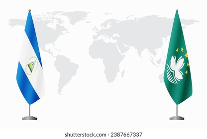Nicaragua and Macau flags for official meeting against background of world map.