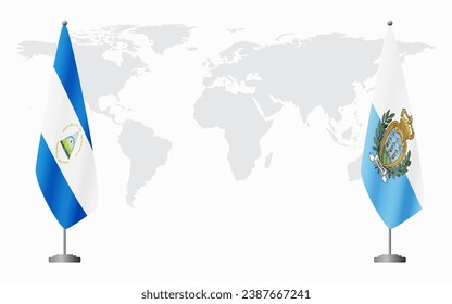 Nicaragua and San Marino flags for official meeting against background of world map.