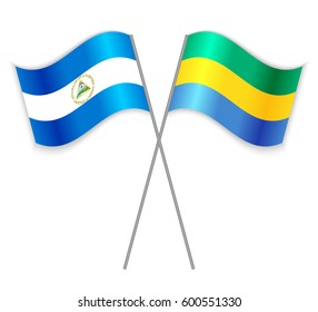 Nicaraguan and Gabonese crossed flags. Nicaragua combined with Gabon isolated on white. Language learning, international business or travel concept.