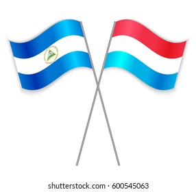 Nicaraguan and Luxembourgish crossed flags. Nicaragua combined with Luxembourg isolated on white. Language learning, international business or travel concept.