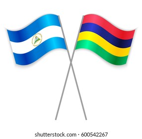 Nicaraguan and Mauritian crossed flags. Nicaragua combined with Mauritius isolated on white. Language learning, international business or travel concept.