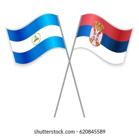 Nicaraguan and Serbian crossed flags. Nicaragua combined with Serbia isolated on white. Language learning, international business or travel concept.