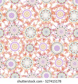 Nice blue, pink and orange hand-drawn seamless vector illustration. Elegant seamless pattern with floral and Mandala elements.