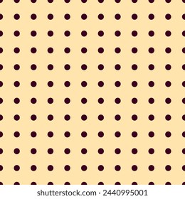 Nice brown on pastel yellow seamless pattern with dots. Dotted repeating texture in a row. Background