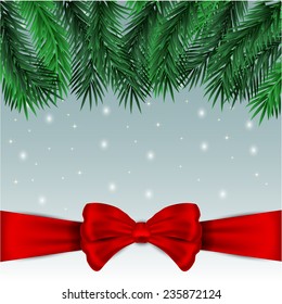 Nice brunch of firtree with bow  on thes now background