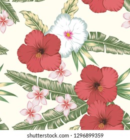 Nice flowers red hibiscus and plumeria (frangipani) on the green palm banana leaves seamless vector pattern. Exotic botanical background